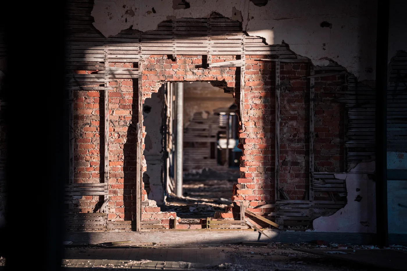 A succession of weathered brick arches inside Fort Adams